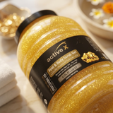 Close-up texture detail of ActiveX Gold Foot and Body Scrub Gel with exfoliating particles