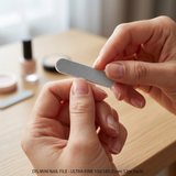 Using DIS mini nail file for shaping and smoothing nails during manicure