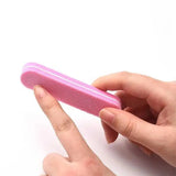 Professional nail buffer being used during manicure treatment for smooth nails