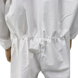 White coverall worn by a person on a white background